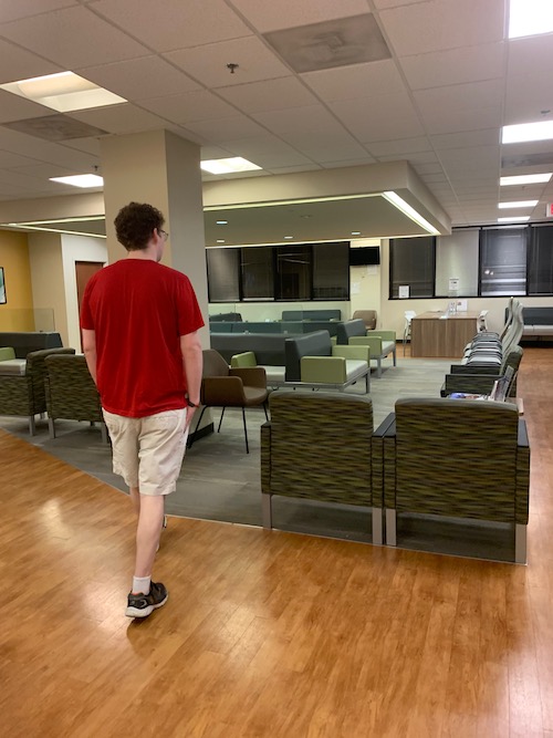 Clinic from a hospital with person walking through it with no other people